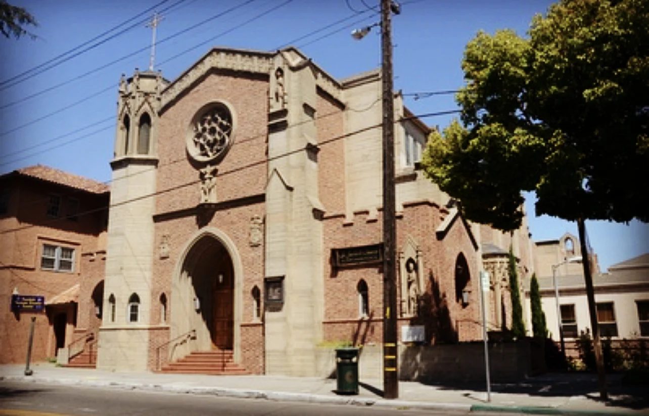 The brick facade of St. Jarlath Church in Oakland